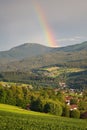 Lam, a small town in Bavaria in the summertime after a thunderstorm with a rainbow. View to mount GroÃÅ¸er Arber with its two